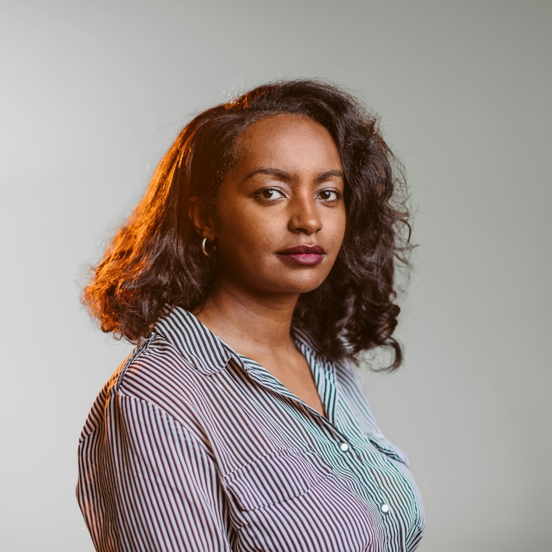 Professional headshot of a woman smiling in business attire